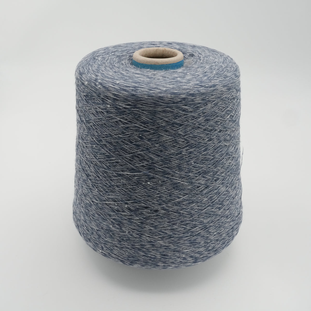 Cone of Linette cotton and linen blend yarn in Sapphire Melange.