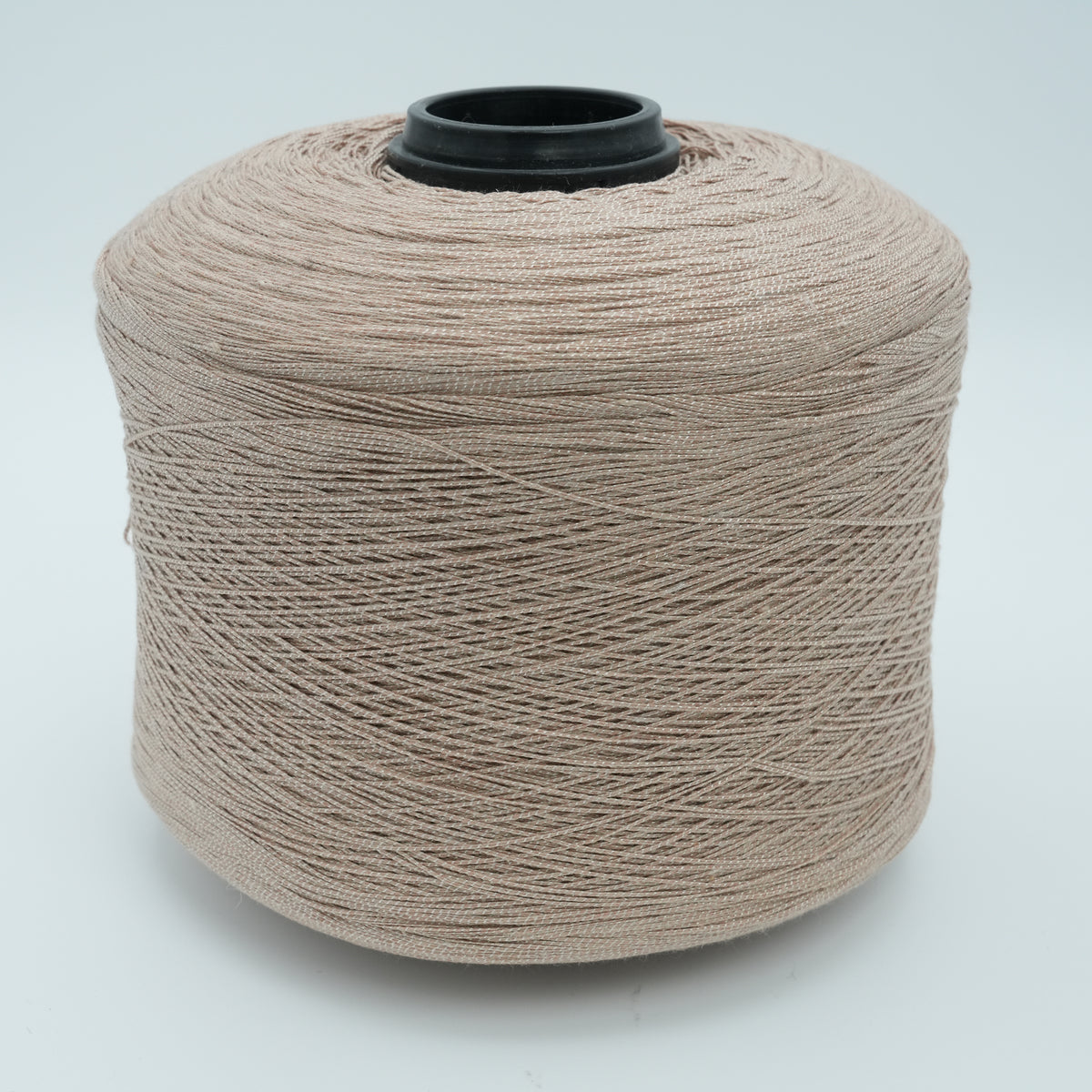Cone of Lisbona cotton blend yarn in Crème Brûlée.