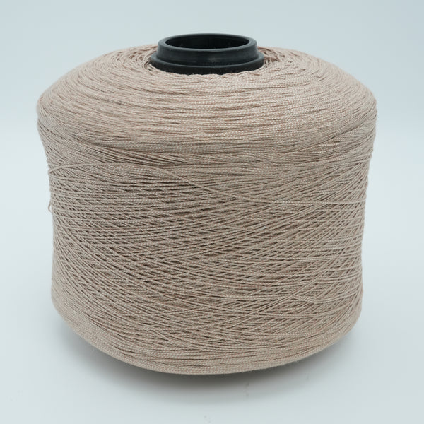 Cone of Lisbona cotton blend yarn in Crème Brûlée.