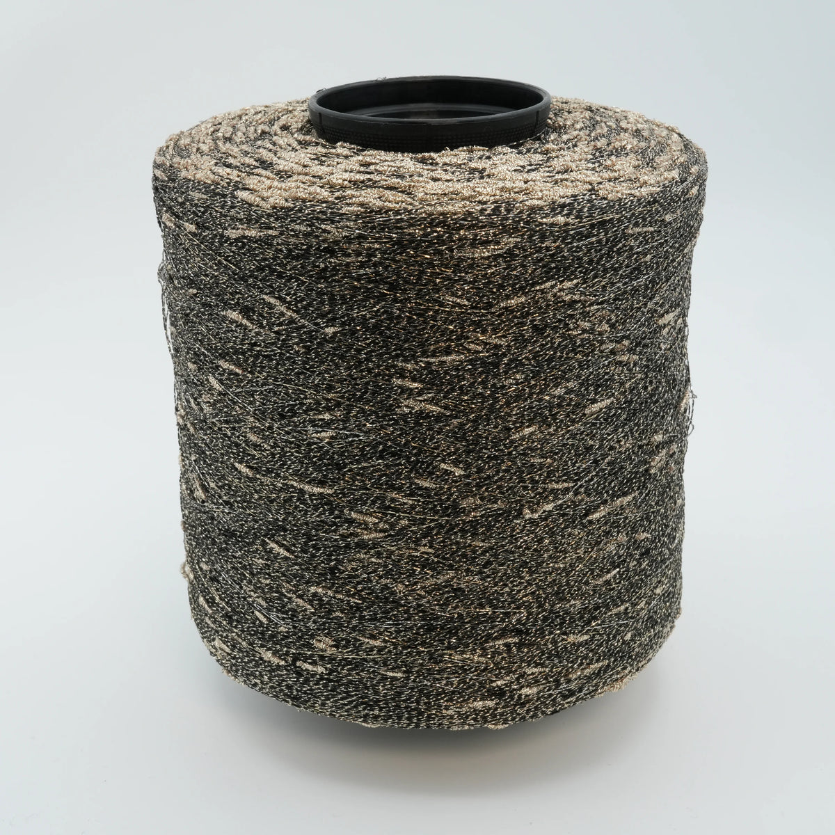 Cone of Luckystar 6000 viscose and slubbed lurex blend yarn in Black Gold.