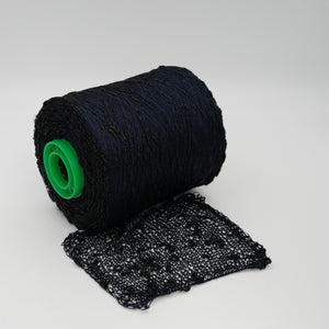 Cone and knitted swatch of Luckystar 6000 viscose and slubbed lurex blend yarn in black.