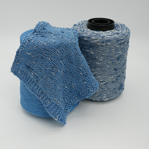 Cone and knitted swatch of Luckystar 6000 viscose and slubbed lurex blend yarn in blue.