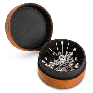 Muud Emeli Magnetic Leather Box | Whisky. Open round leather box holding metal pins.