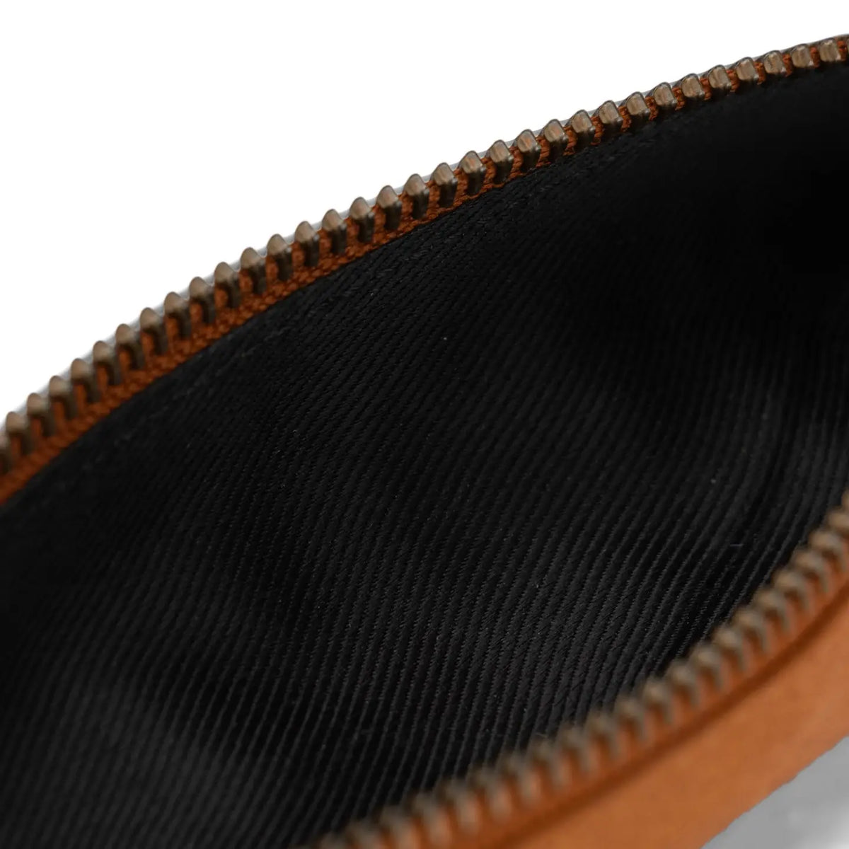 Muud Hee Case | Slim Leather Pouch in Whisky. Close-up of the open case showing its black lining.