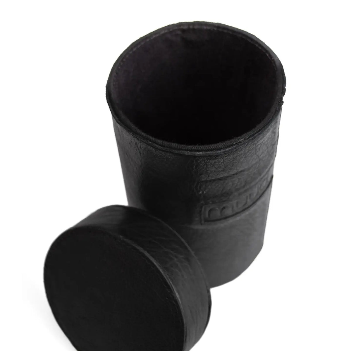 Muud Mountain Cannister | Genuine Leather in Black. Open case beside its round lid.