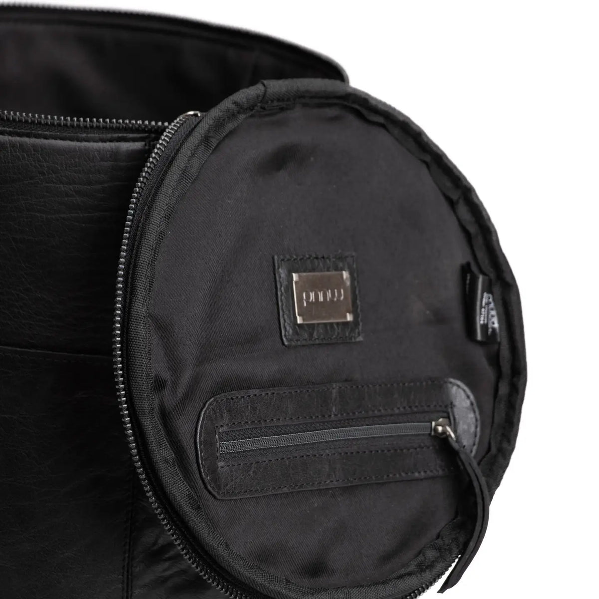 Muud Saturn XL Leather Project Bag in Black. Inside of the lid showing zippered storage.