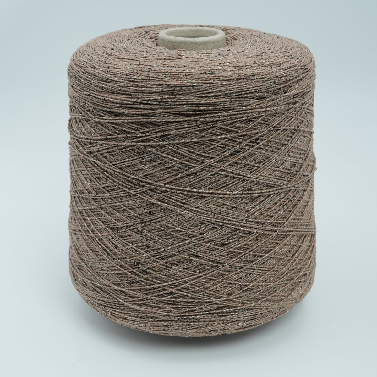 Cone of Neppyness cotton and polyamide blend yarn in Earth Pepper.