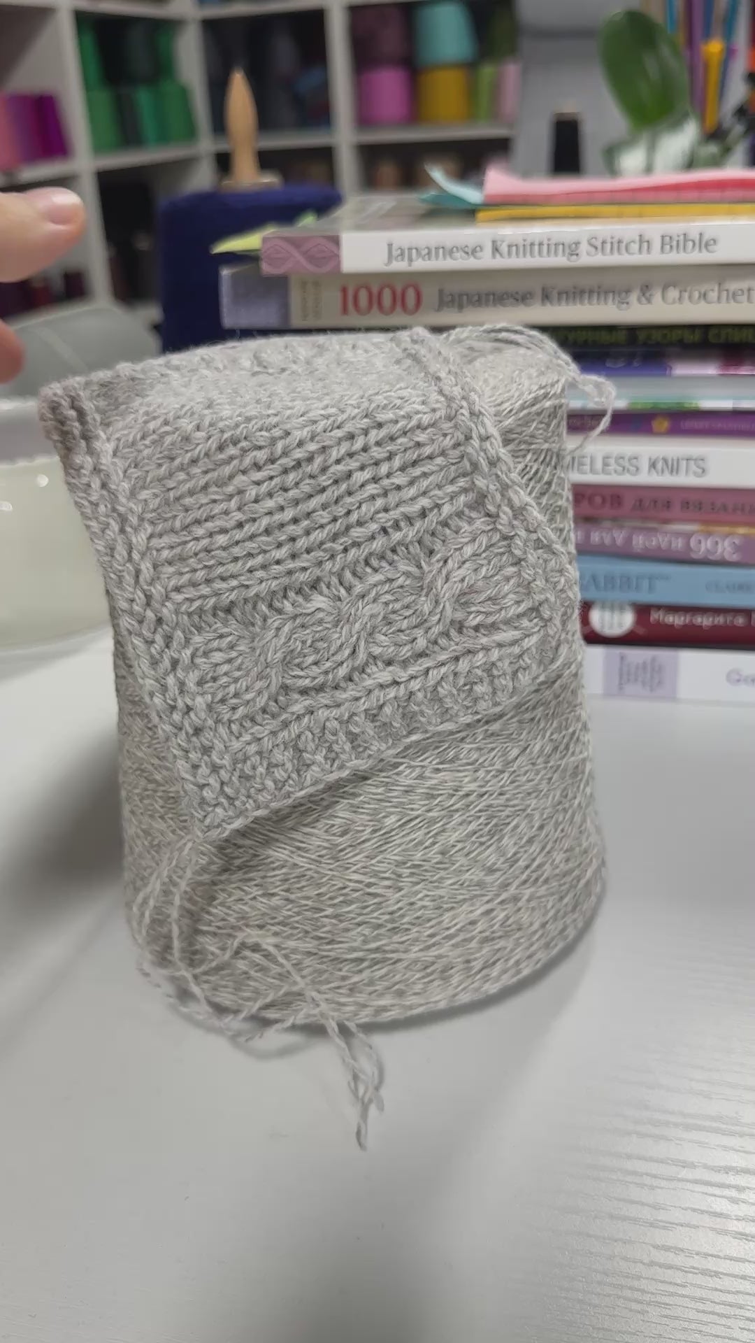 Video showing cone and knitted swatch of Orchidea 2/15000 merino and polyamide blend yarn in Pale Heather.