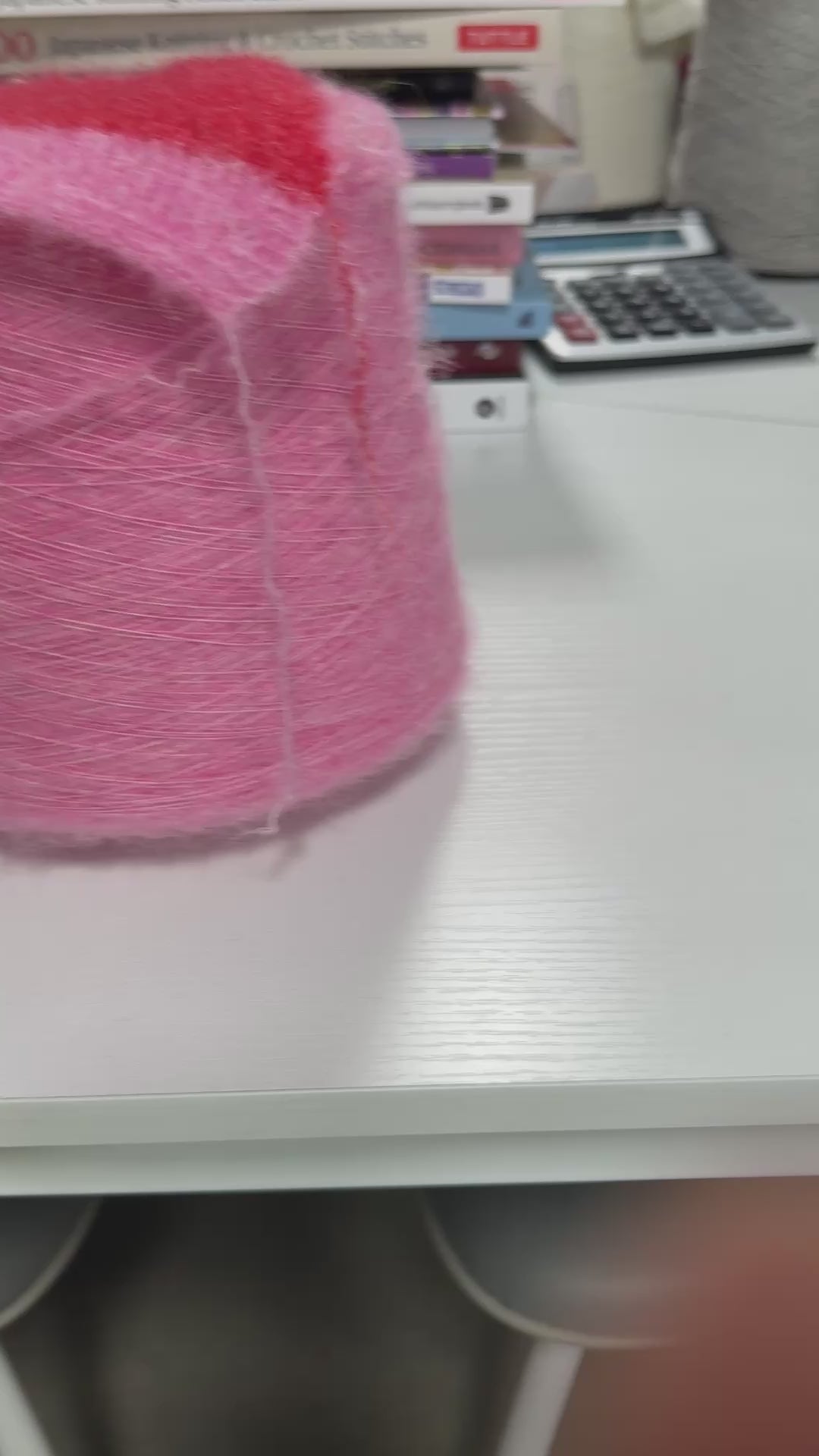 Video showing cone of Essence 12000 fluffy alpaca blend yarn in Bubblegum Cloud.