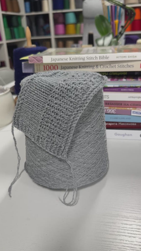Video showing cone and knitted swatch of Sudoku 2/14 wool blend yarn in Morning Fog.