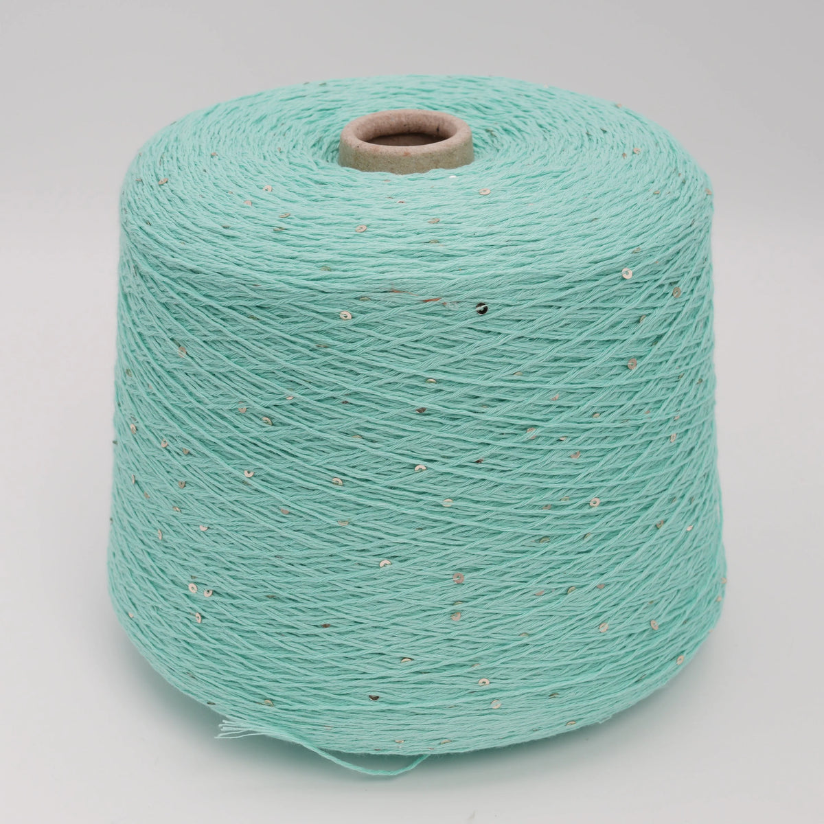 Cone of Primavera NM4200 cotton and sequin blend yarn in Mint Seafoam.