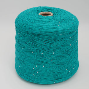 Cone of Primavera NM4200 cotton and sequin blend yarn in Tropical Teal.