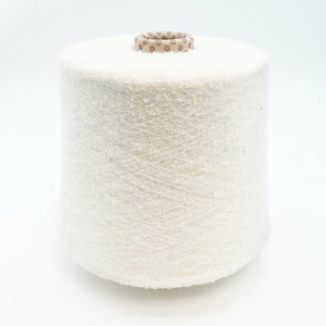 Cone of Puff micro bouclé cashmere blend yarn in Milky Snow.