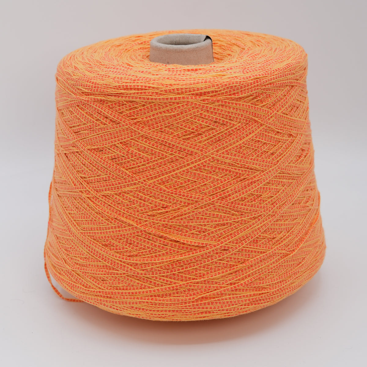 Cone of Rail 4600 flat ribbon yarn, a cotton and polyamide blend by Gruppo Filpucci.