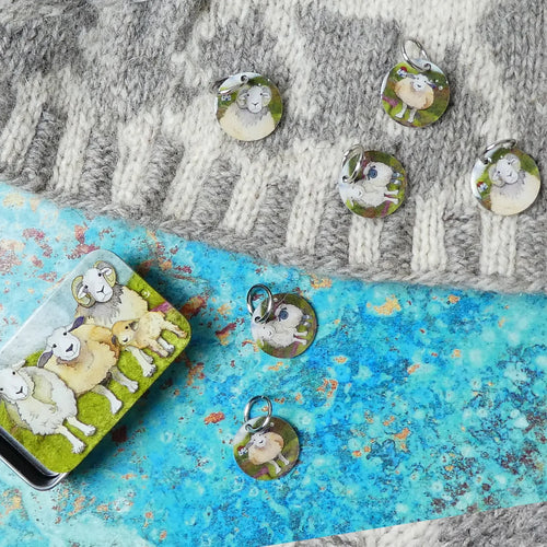 Ring Stitch Markers (set of 6) in Pocket Tin by Emma Ball in Felted Sheep Stitch.