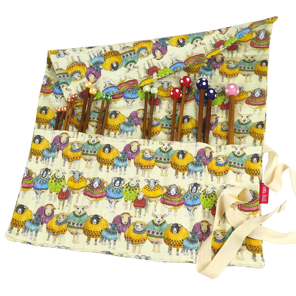 Straight Needle Roll. Needle roll opened to show pockets and a colorful sheep print.
