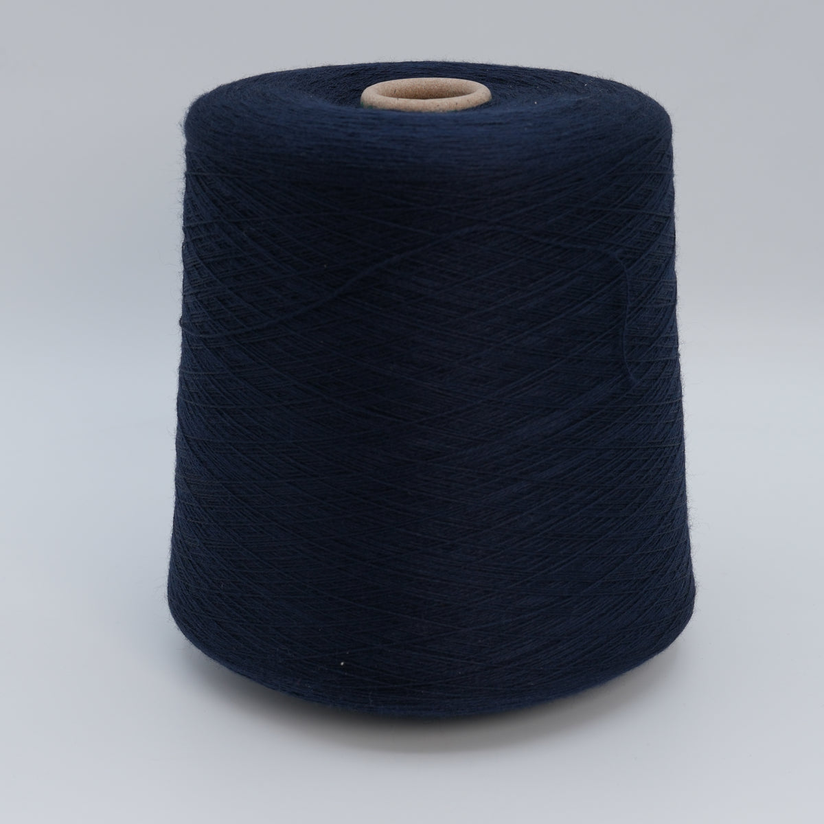 Cone of Victoria 2/30 100% merino yarn in Shiny Navy.