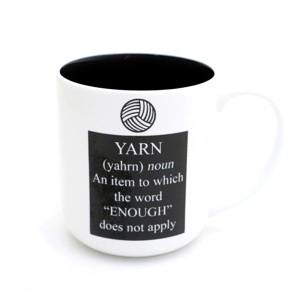 Yarn Definition Mug. White mug with a black interior and yarn definition print.